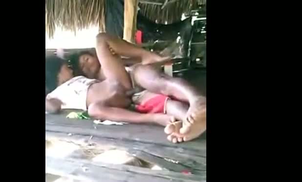 Young couple enjoy outdoor sex in a tent house on the beach
